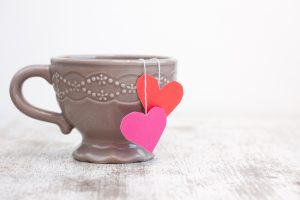 cup with heart shaped tea bag